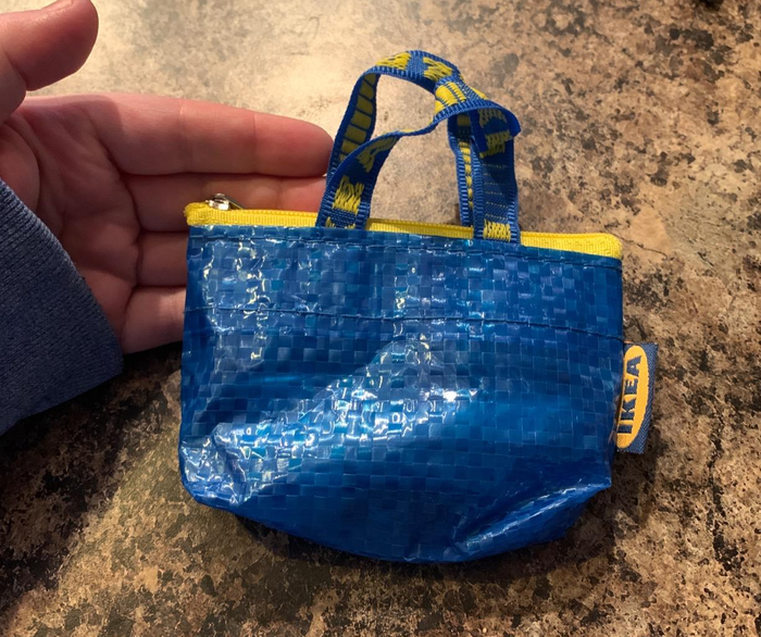 A reviewer showing off their Ikea bag coin purse.