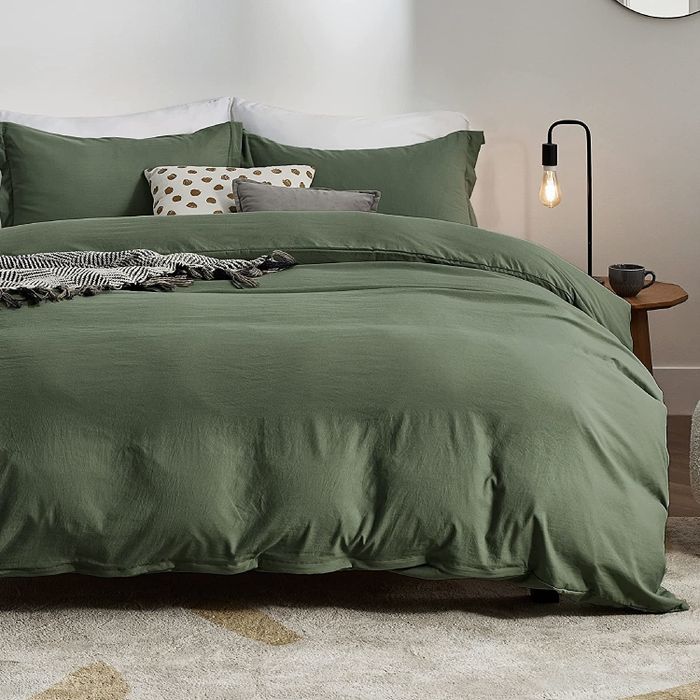 A duvet cover and shams neatly arranged on a bed.