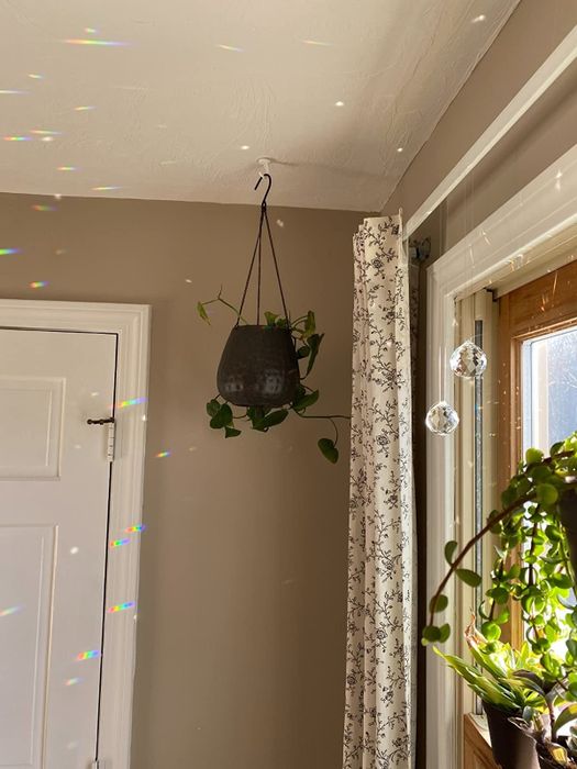 Customer image of the two prisms in a window, with rainbows reflecting in the room.