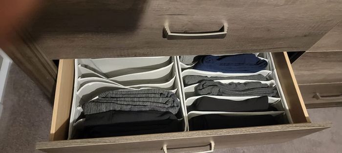 A reviewer photo showing the organizers with pants neatly arranged.