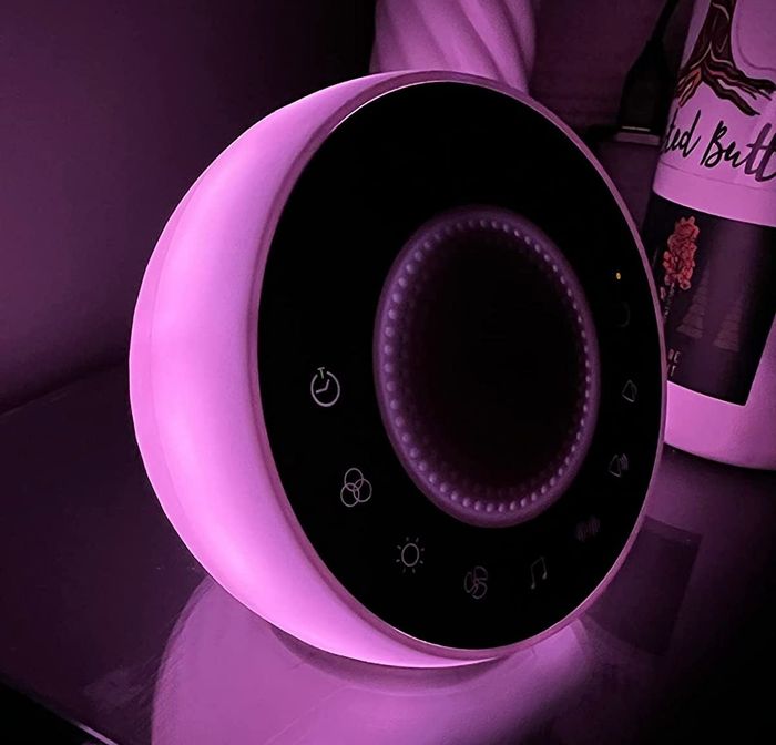 Customer image of the machine glowing with purple light.
