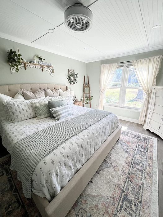 A photo from a reviewer showing the blanket spread on a bed.