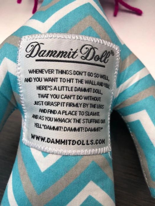 Close-up shot of the doll's patch explaining how to use it
