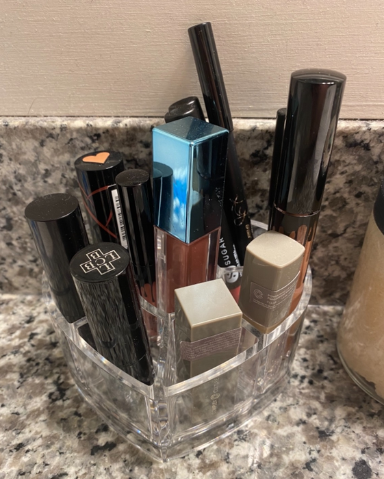A full lipstick organizer brimming with various lip products