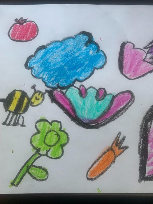 A simple, playful child’s drawing featuring various items like a flower, a bee, and hearts.