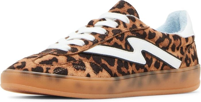 Leopard print sneakers featuring white laces, a white stripe, and a translucent gum sole.