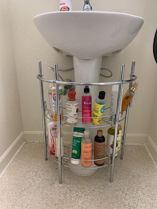 The silver two-tier organizer placed in a reviewer’s bathroom.