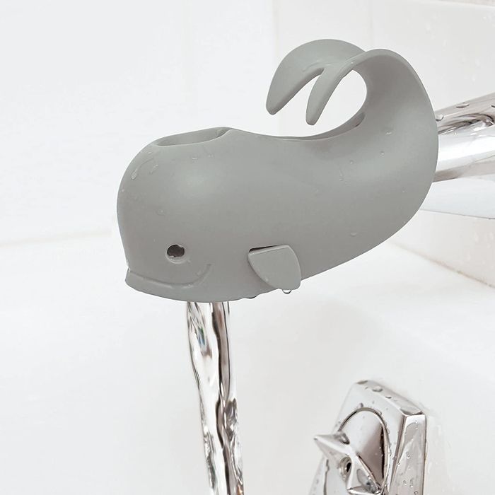The spout cover in a neutral gray color, designed to keep bath time safe and fun.