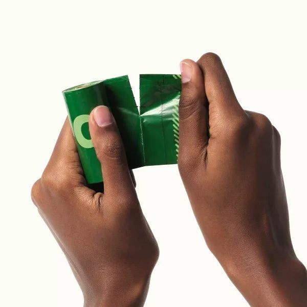 Two hands opening a bag