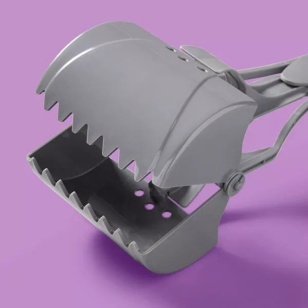 Gray pooper-scooper with serrated edges