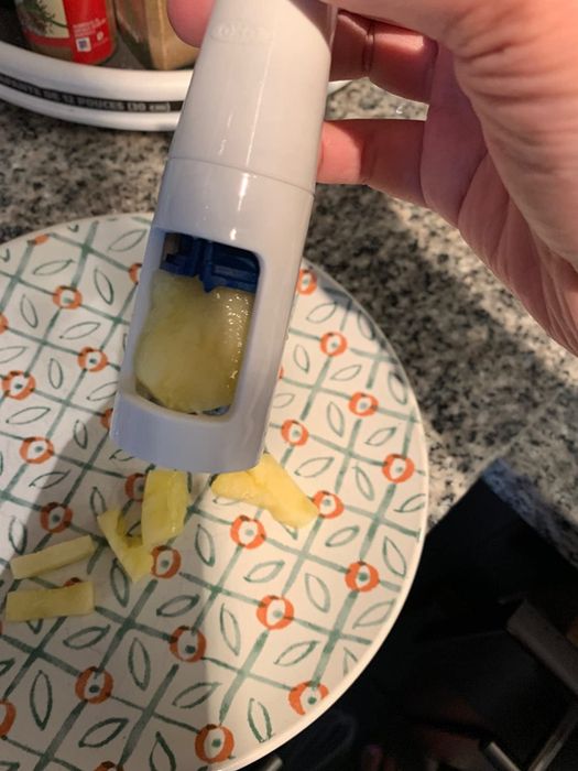 A photo provided by the reviewer of the grape cutter, showcasing its design and functionality.