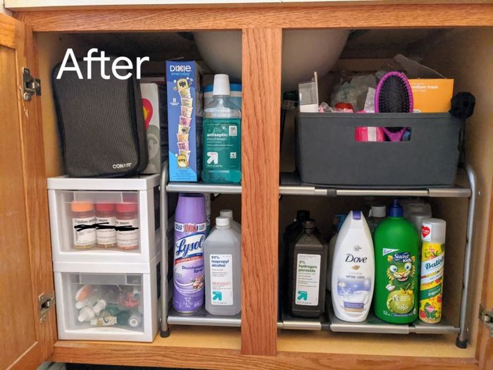 The same reviewer’s after shot, showing the cabinets beautifully organized with a two-tier shelf.