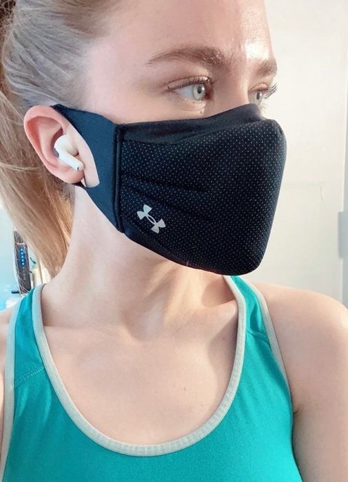 Mytour editor wearing a black face mask that slightly protrudes from the face.