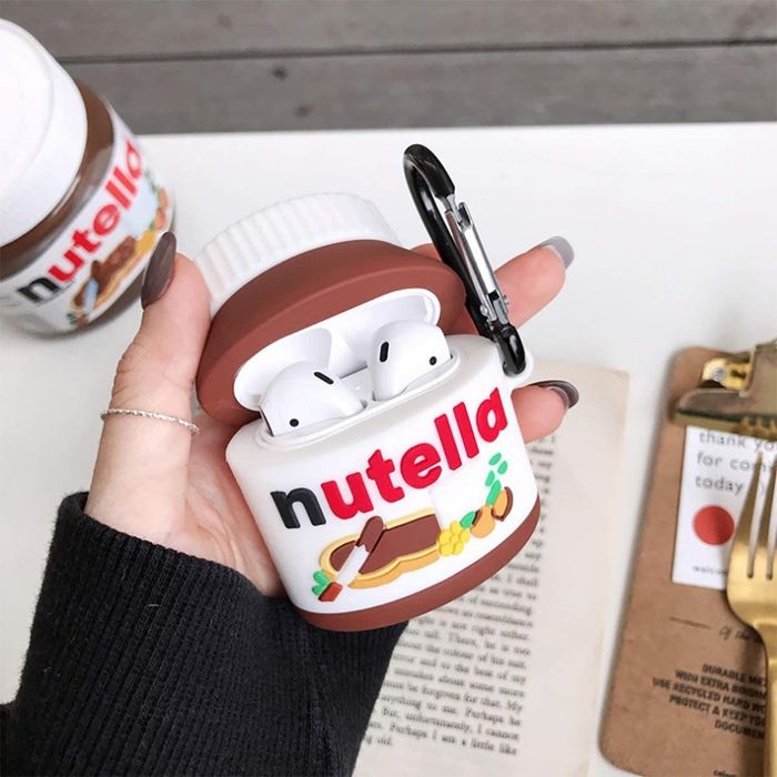 A model holding a silicone AirPods case designed to look like a Nutella jar.