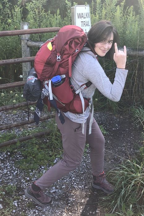 The writer confidently strikes a pose with the Osprey pack, proudly displaying its comfortable hip belts and overall design.