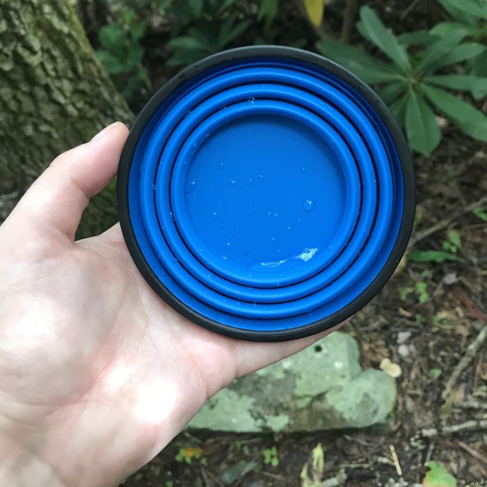 The mug, when collapsed, lies completely flat