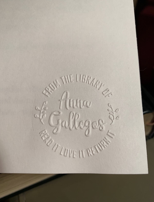 A reviewer’s embossed page with floral designs around the edges.