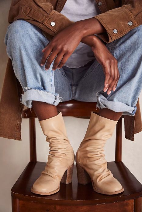 A model showcasing the boots in the natural cane shade