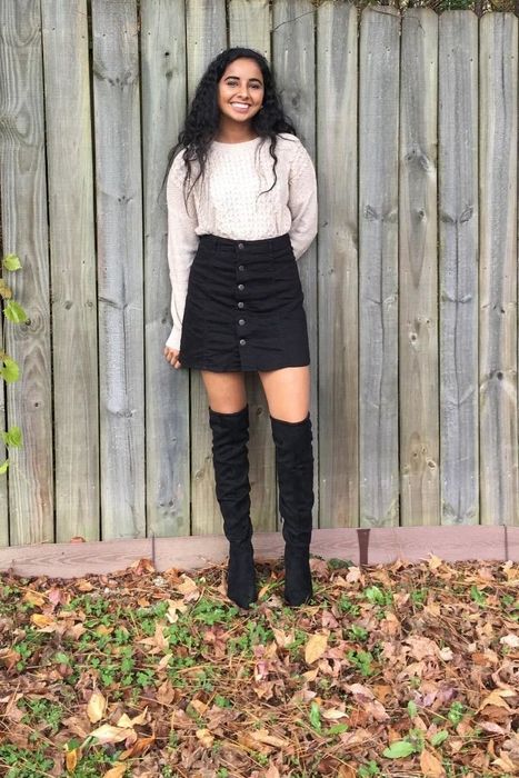Another reviewer rocking the black boots with a skirt