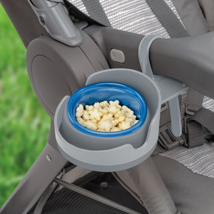 The cup holder supporting a bowl filled with puffs.