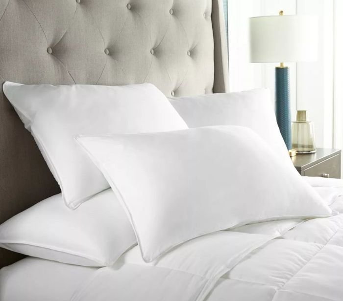 The pillows on a bed.