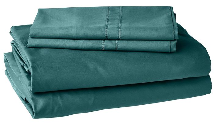 The sheet set in a calming teal color.