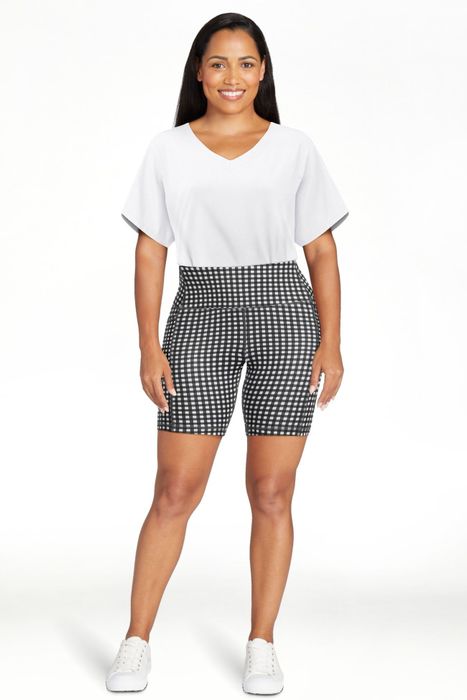 A model wearing black and white gingham shorts.