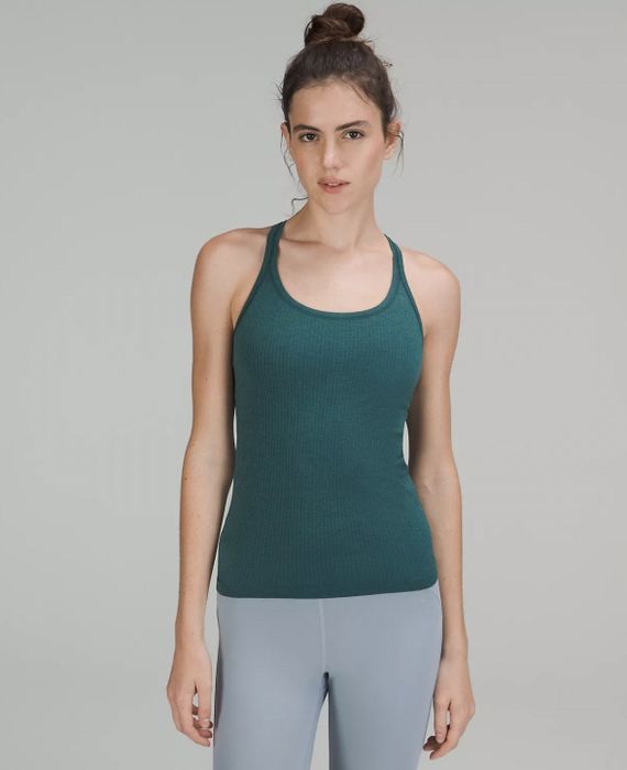 a model wearing the teal tank top