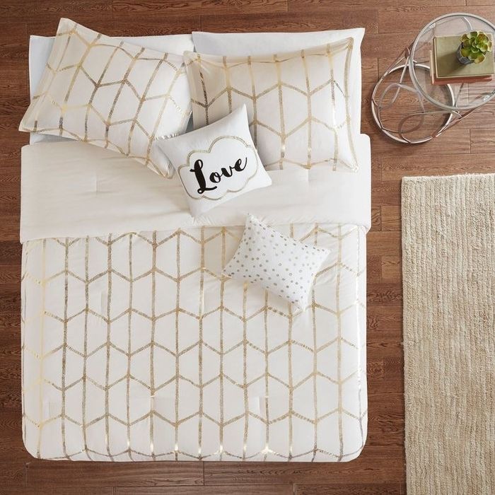 A pristine white bedding set that transforms your bed into a serene haven of simplicity.