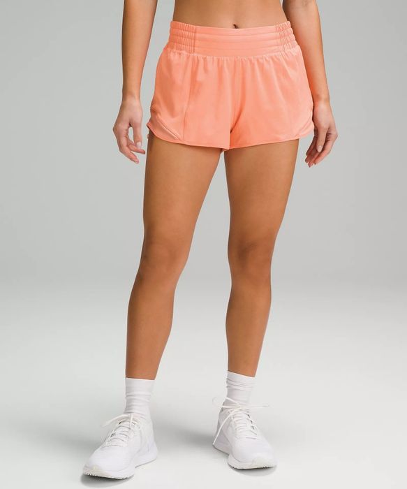 Image of a model wearing orange shorts