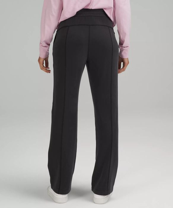 a model wearing black pants