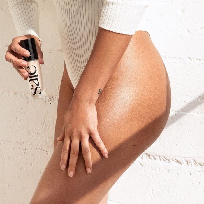 Saie Glowy Super Gel applied to legs for a radiant, dewy finish