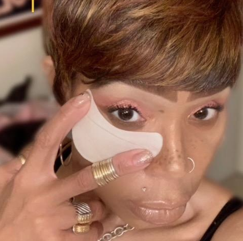 reviewer using eyeshadow shields during makeup application