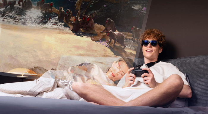 A model enjoying a game while sporting AR sunglasses