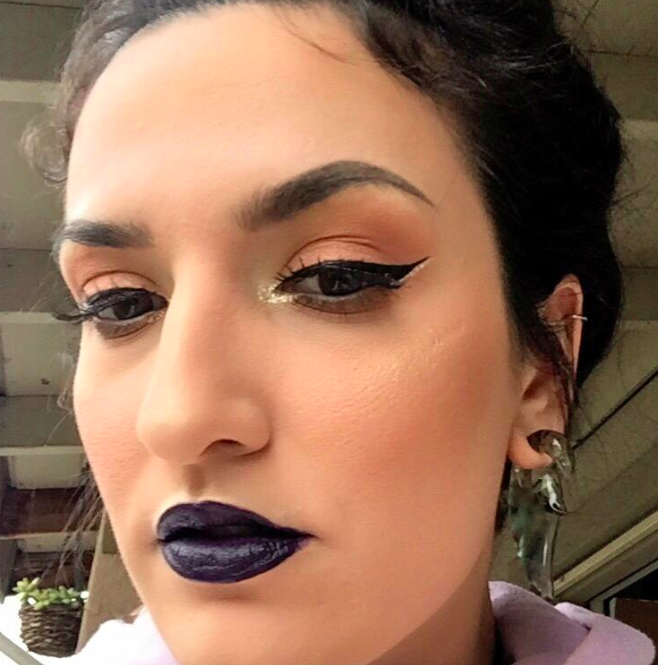 Customer showcasing a flawless makeup look achieved with a winged eyeliner stamp