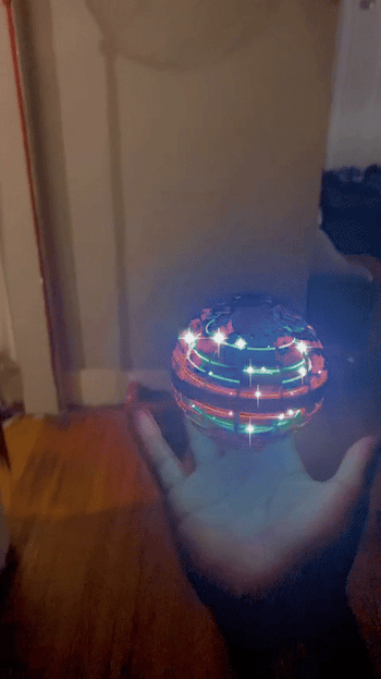 A GIF of a reviewer interacting with a spinning floating ball