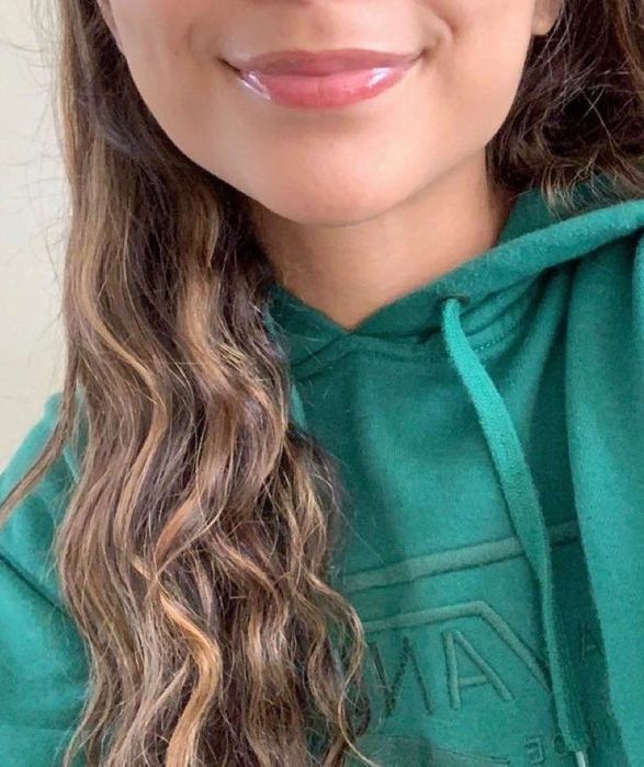 A reviewer wearing one of the lip glosses.