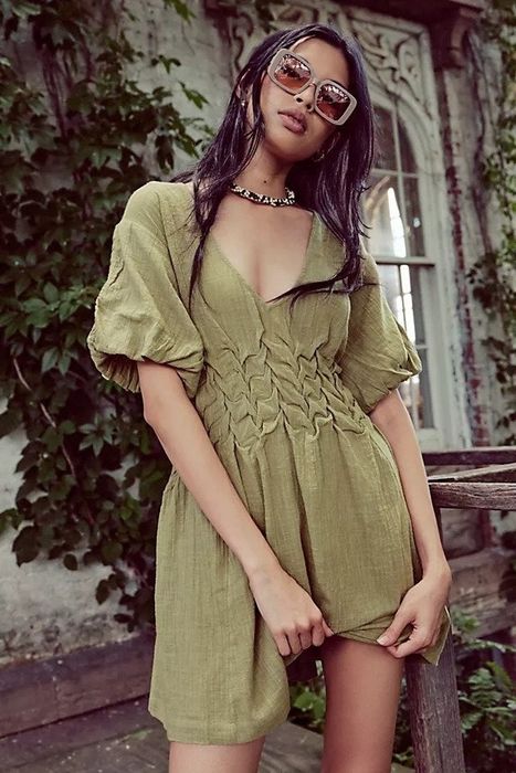 A model wearing the willow green dress