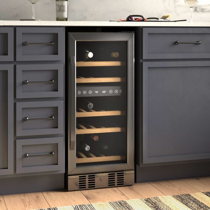 The wine fridge positioned beneath a kitchen counter