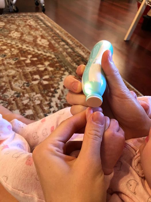 a reviewer trimming their baby's nails