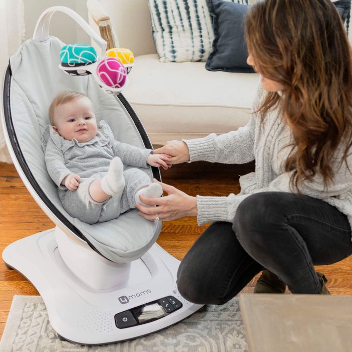 a mother and child relaxing in the mamaroo seat