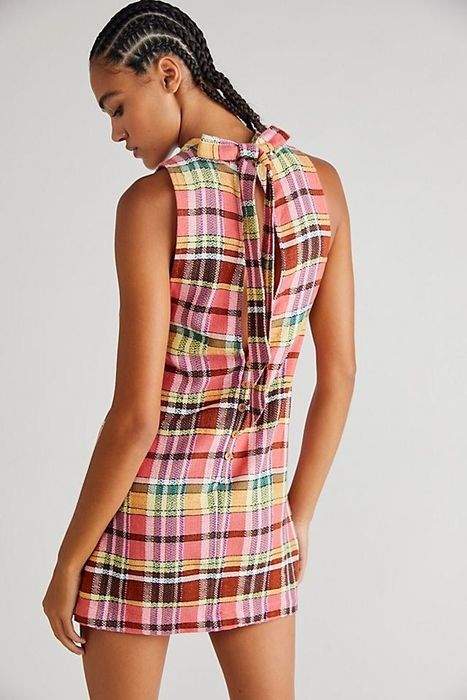 Detailed view of the back design of the dress, emphasizing its unique features.