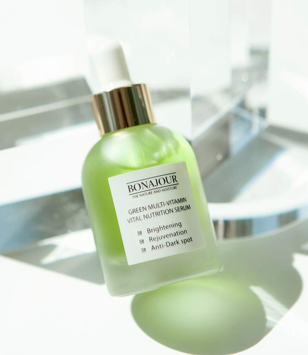 Bonajour Green Multi-Vitamin Vital Nutrition Serum bottle with a dropper, labeled for brightening, rejuvenation, and anti-dark spot benefits