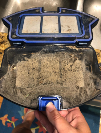 A vacuum once plagued by dust but now operating at its full potential after thorough improvement.