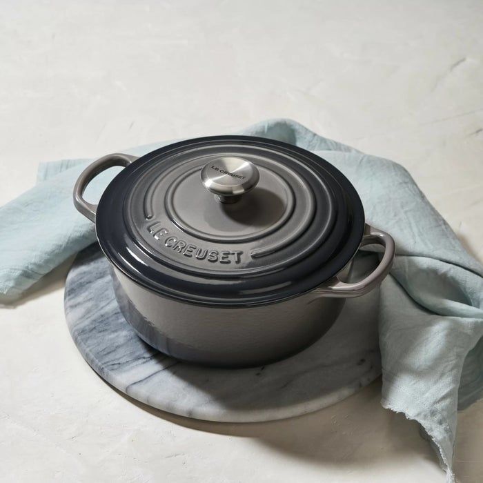 The Le Creuset Dutch oven, featuring side handles and a matching lid