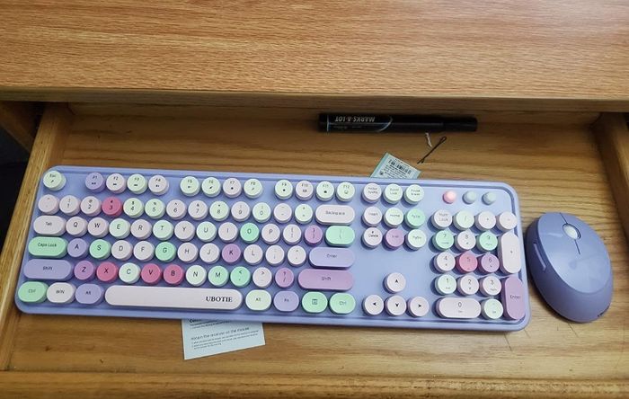 a user-submitted photo displaying the purple keyboard alongside its matching mouse