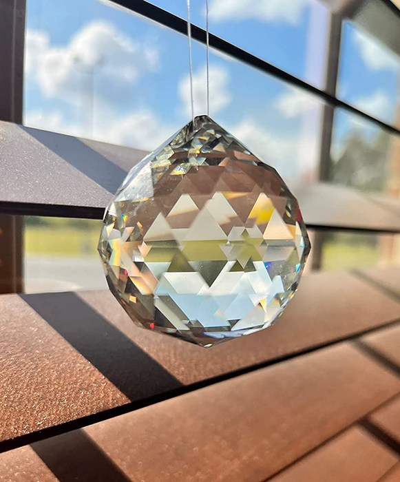 a user-submitted photo of a prism hanging gracefully in front of a window