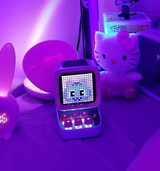 the Divoom Bluetooth speaker glowing softly at night
