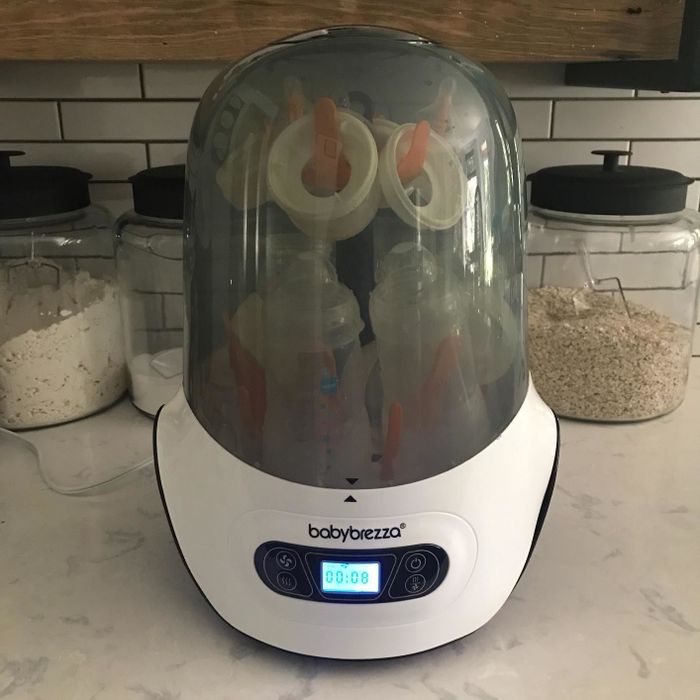 The Baby Brezza machine in action, filled with bottles and turned on.