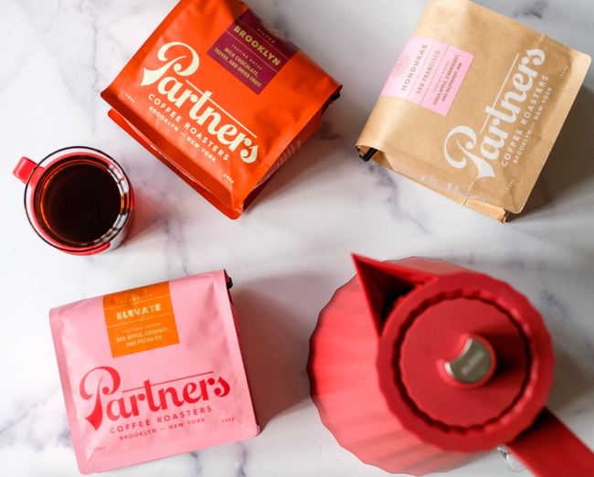 Three bags of Partners Coffee, ready to brew.